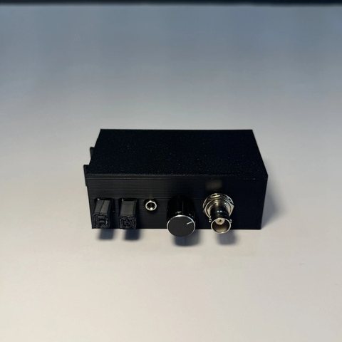 RigidEnhancer 1.1 portable preamplifier, front view with the gain switch and BNC input.