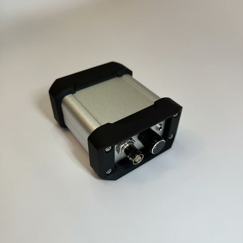 RigidEnhancer 2.0 charge preamplifier, aluminium body with black end caps.